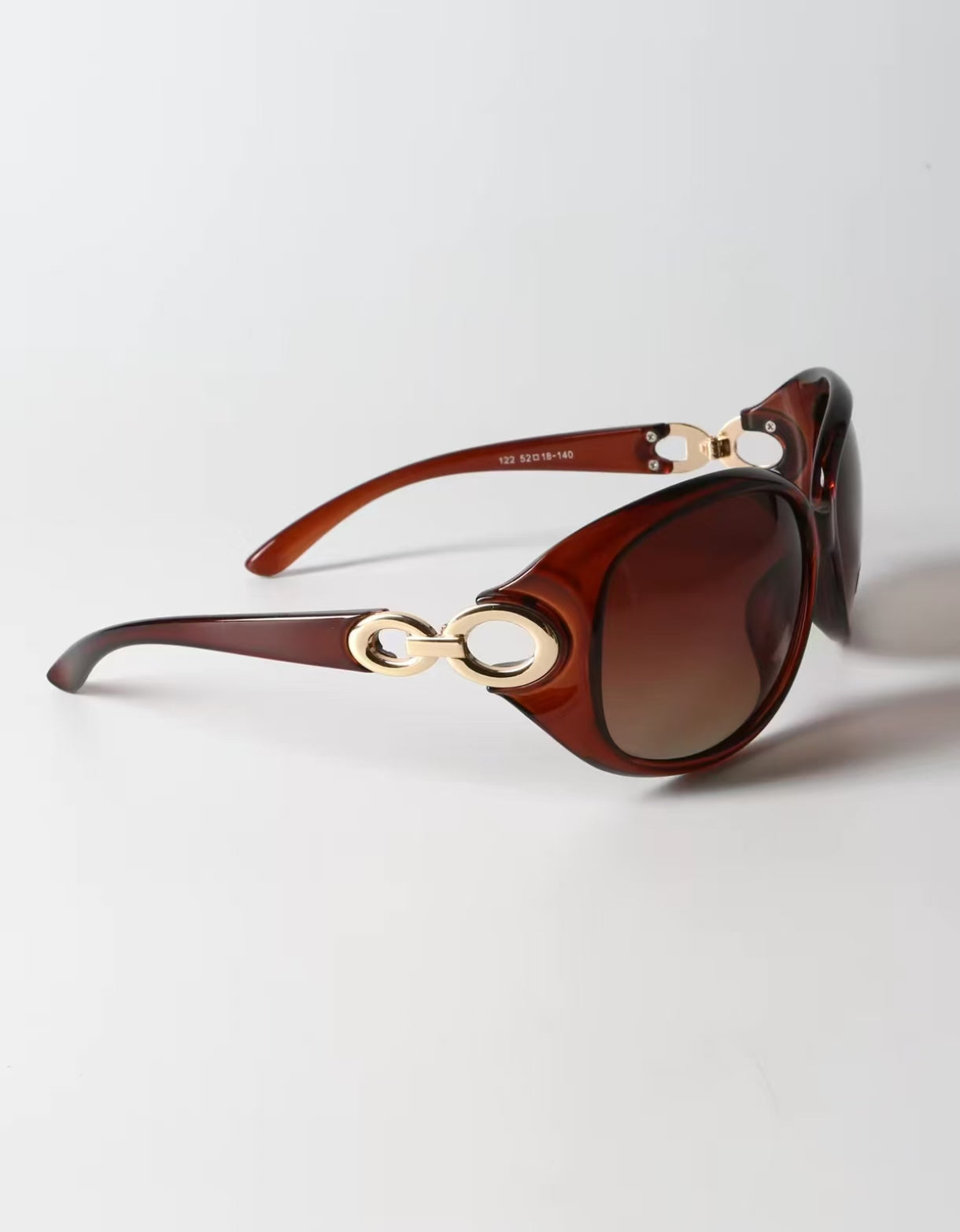 Women’s Amber Brown full-rim oversized oval sunglasses, side view