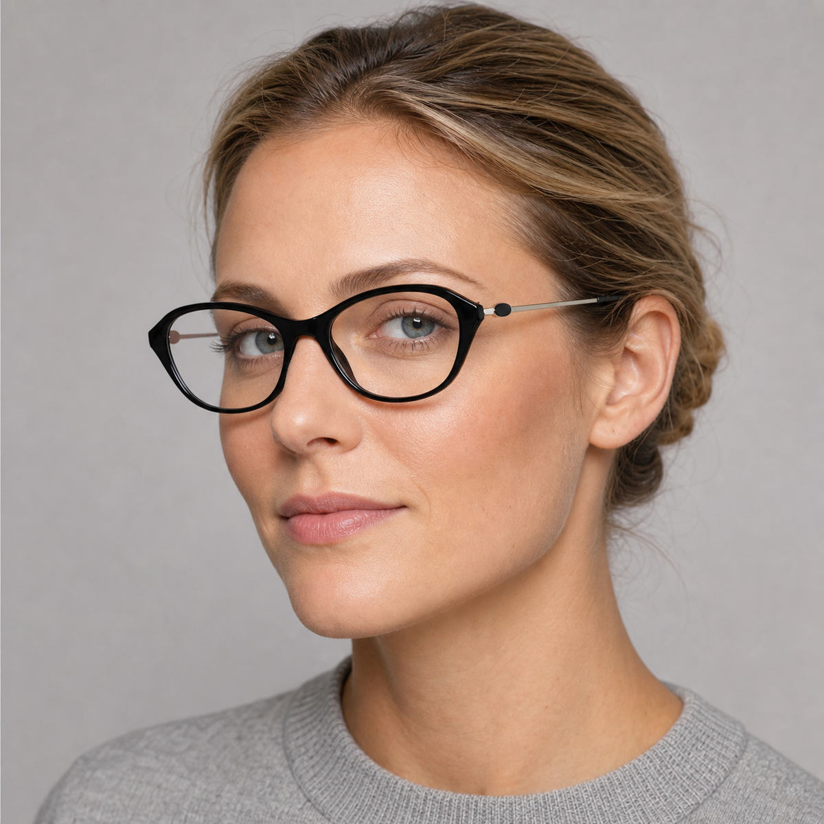 Black cat-eye full-rim glasses worn by an adult White woman