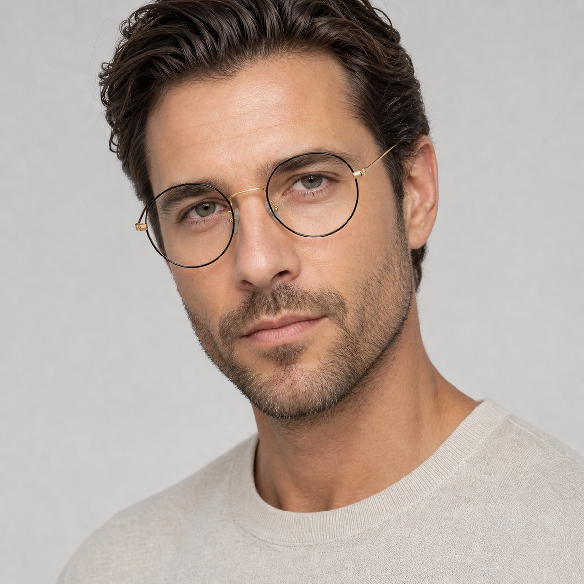 Black & Gold retro slim round glasses worn by an adult White man