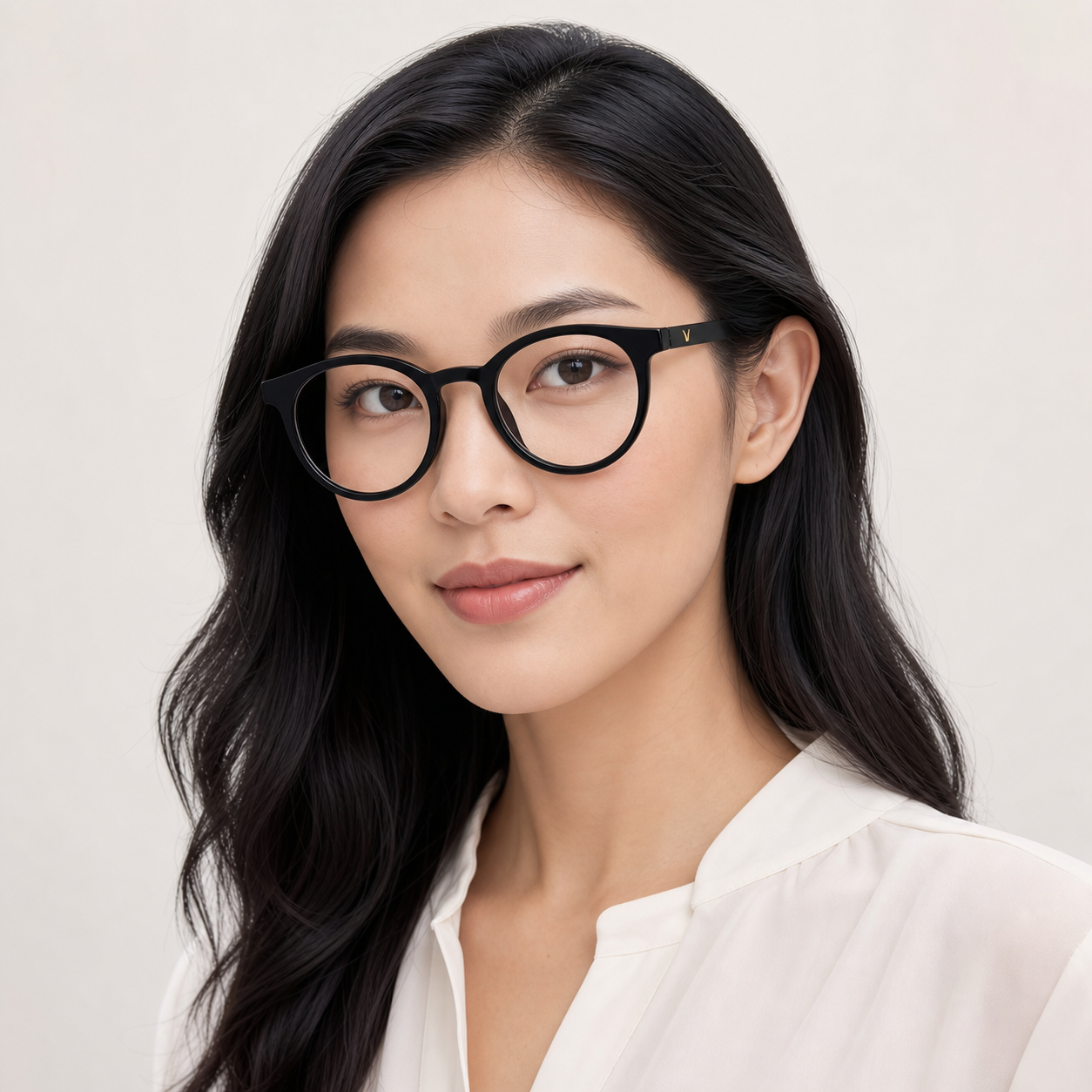 Black softly rounded full-rim glasses worn by an adult East Asian woman