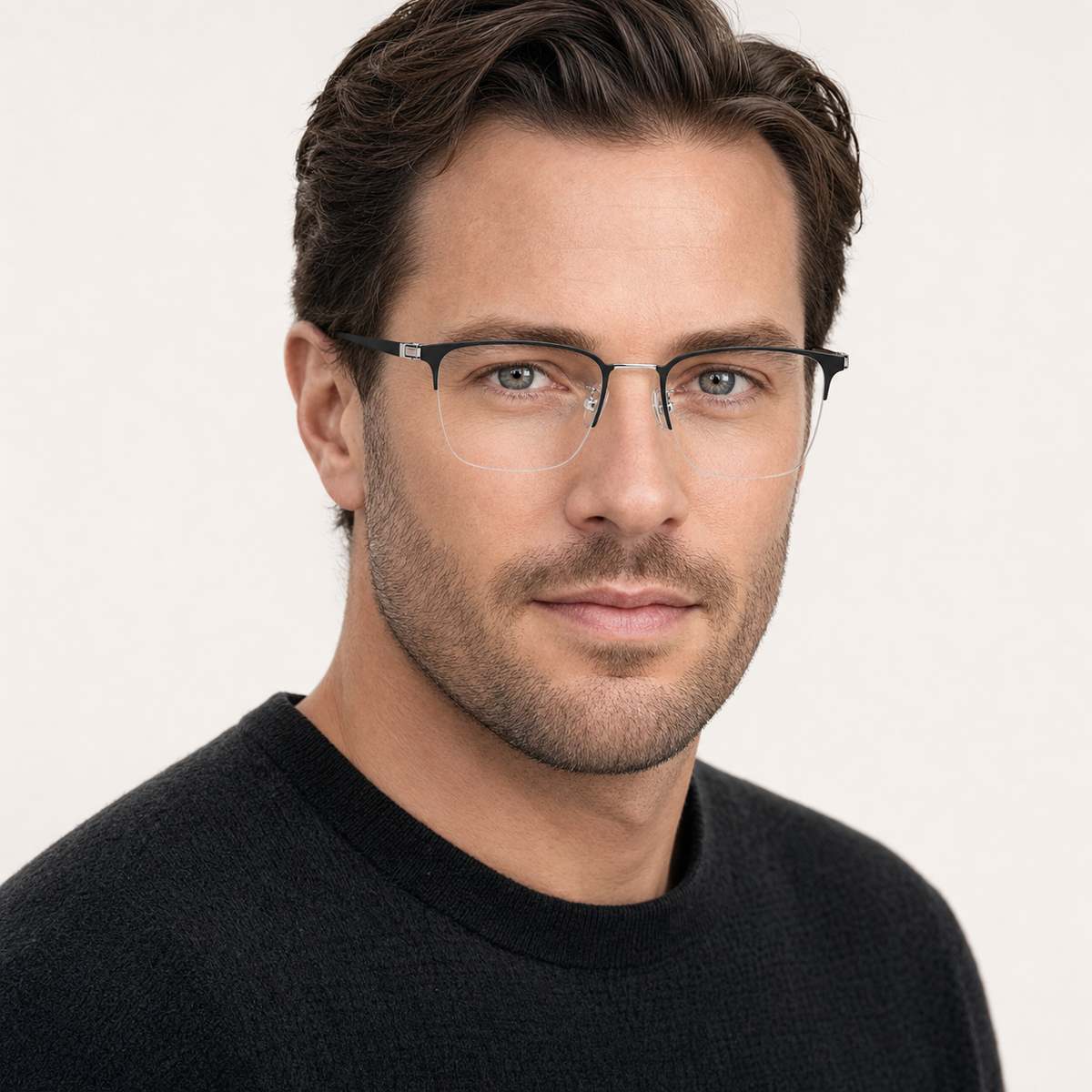 Black/Silver pure titanium semi-rimless glasses worn by an adult White man