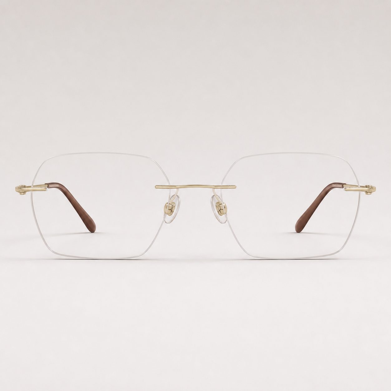 Gold pure titanium rimless geometric rectangular eyeglasses, straight-on product view