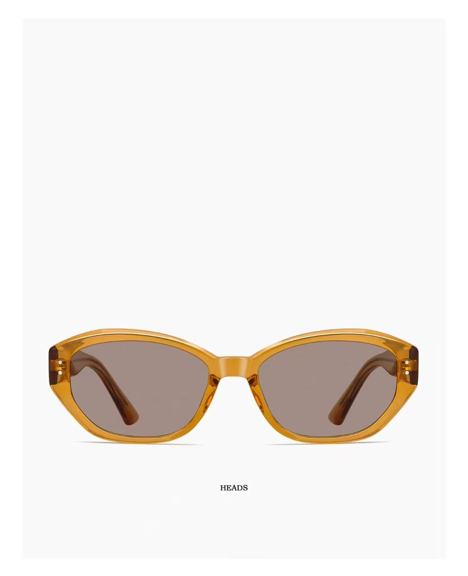 Amber Brown full-rim narrow oval acetate sunglasses, front view