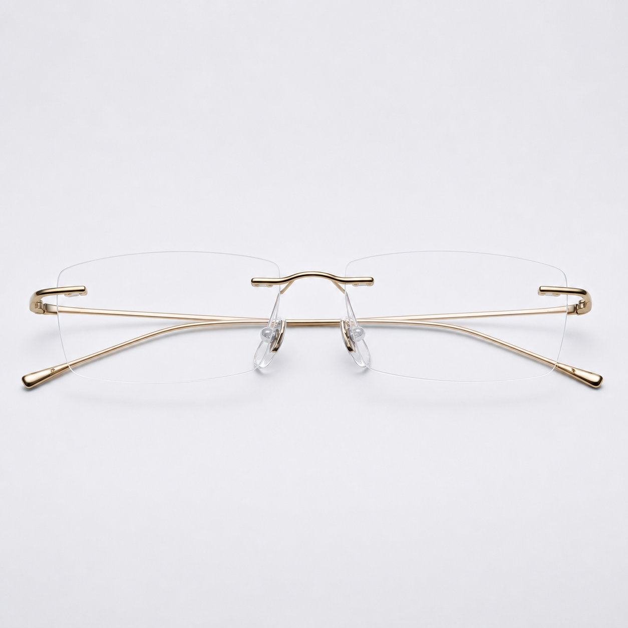 Gold beta-titanium rectangular rimless glasses, front product view