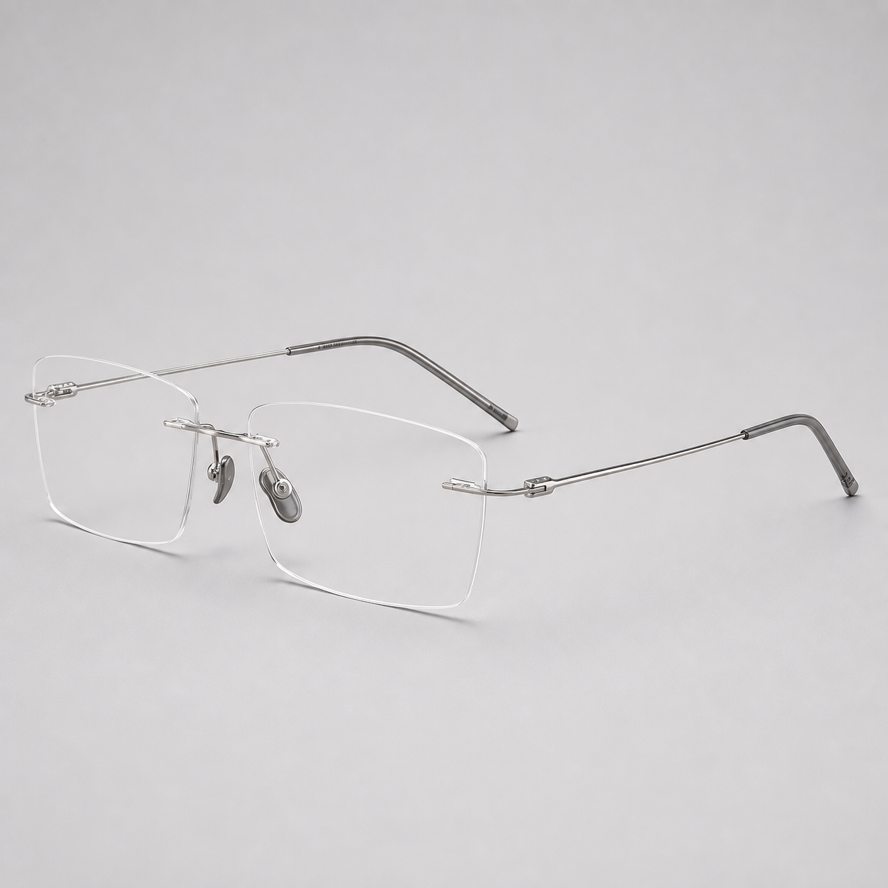 Silver pure titanium rimless shallow rectangular eyeglasses, 45-degree product view