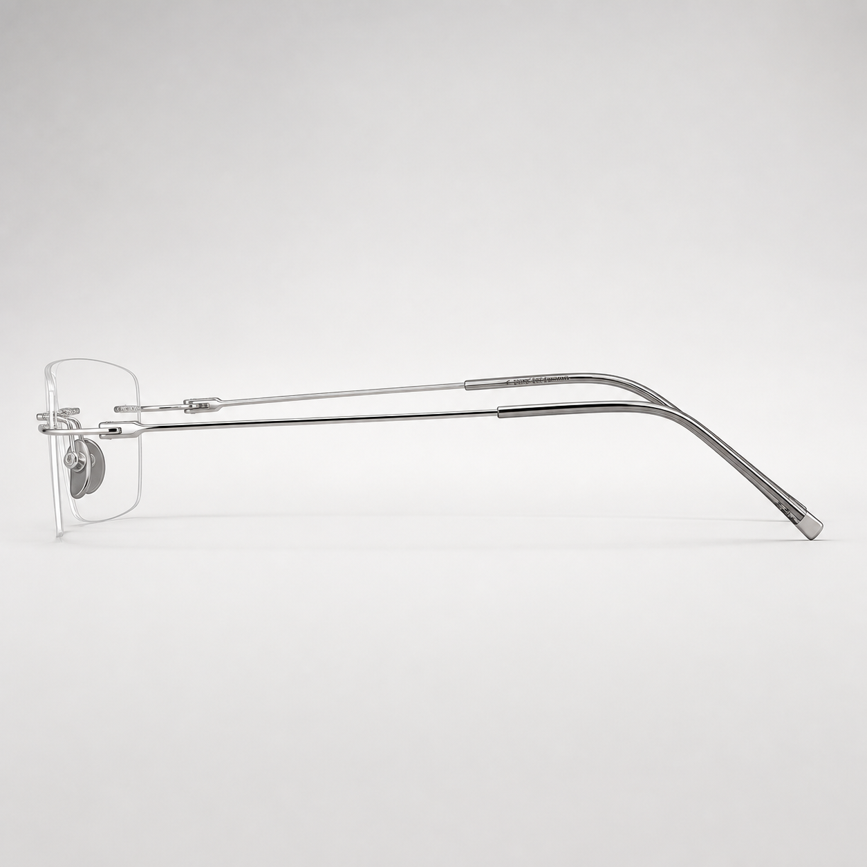 Silver pure titanium rimless shallow rectangular eyeglasses, side-profile product view