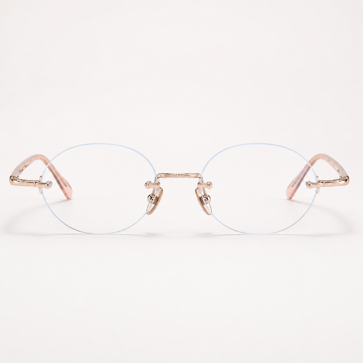 Gold/Pink titanium and acetate rimless oval eyeglasses, straight-on product view