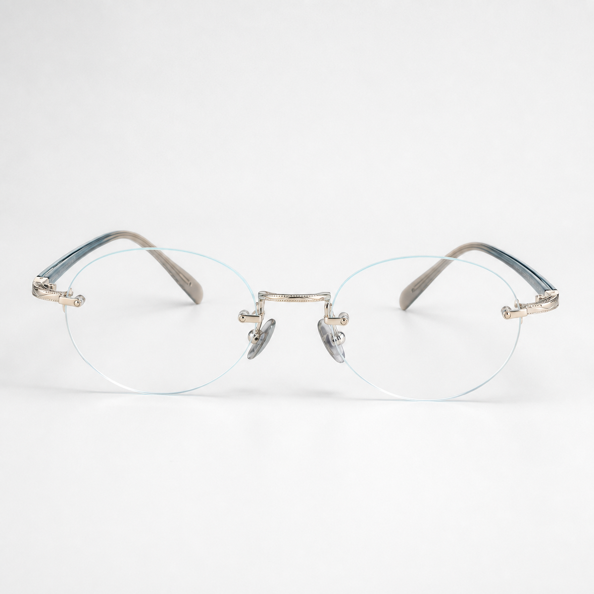Silver/Blue titanium and acetate rimless oval eyeglasses, straight-on product view