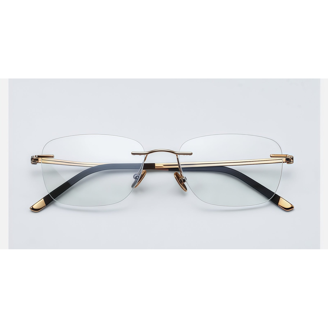 Gold men's pure titanium rimless rectangular glasses, front product view