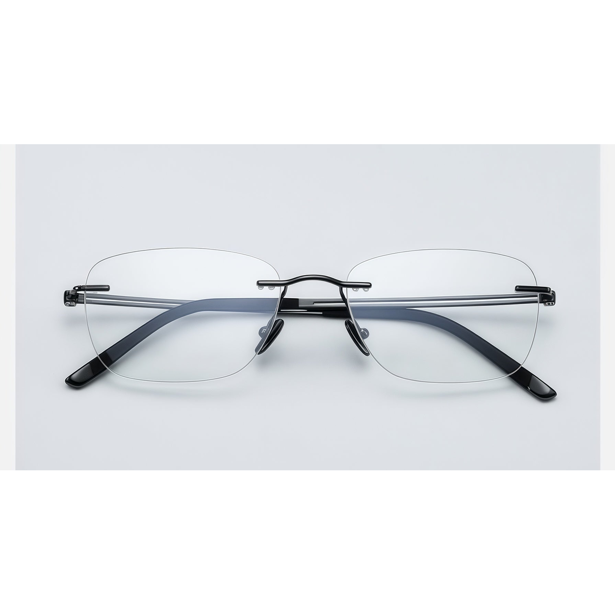 Gunmetal men's pure titanium rimless rectangular glasses, front product view
