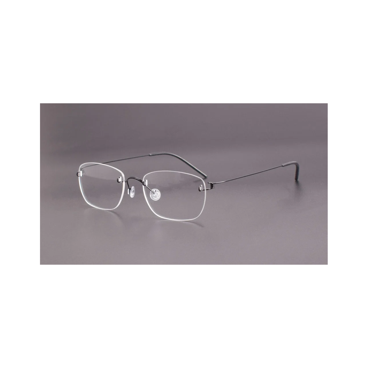 Black men's titanium rimless spring-hinge glasses, 45-degree product view