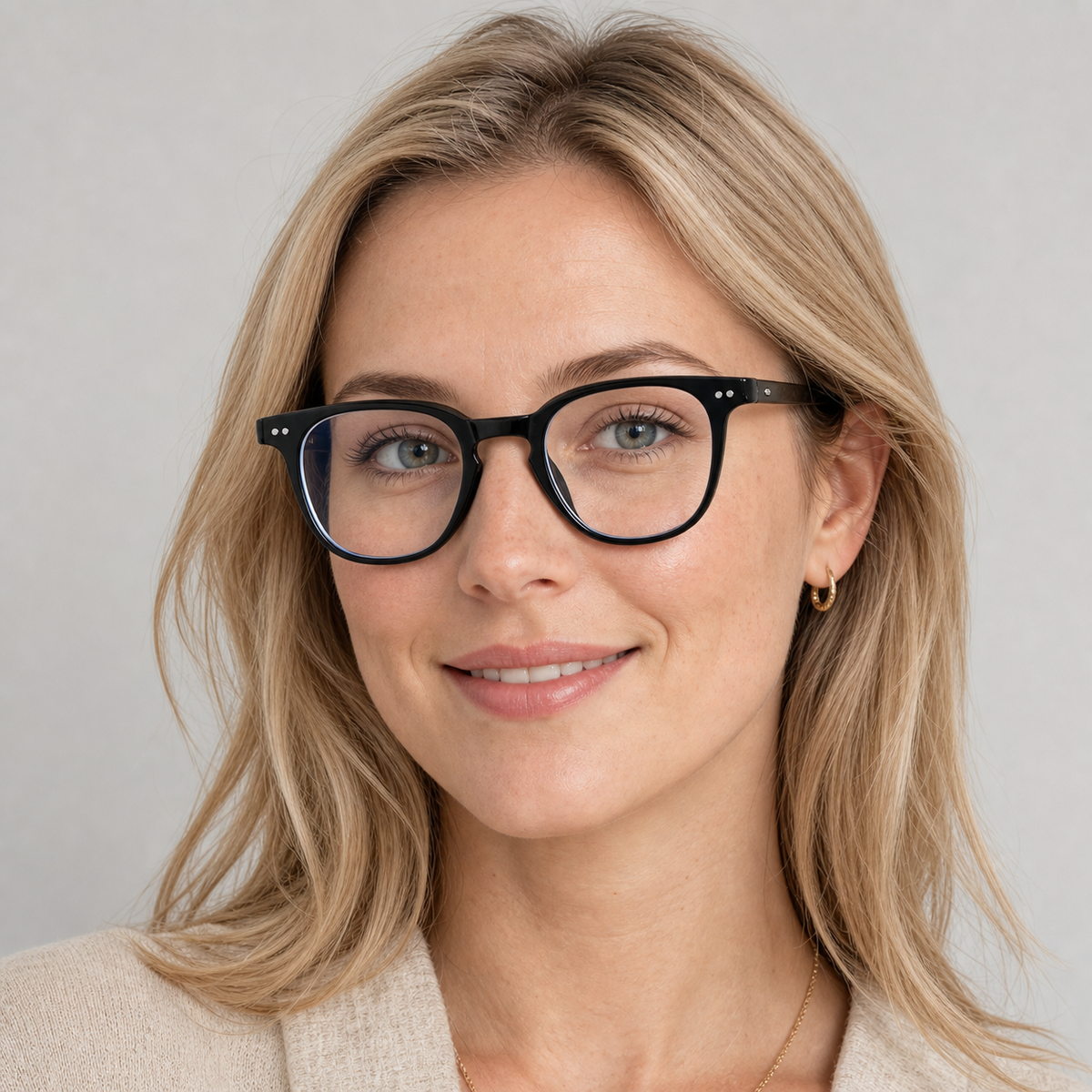 Glossy Black eyeglass frame worn by an adult model, view 1