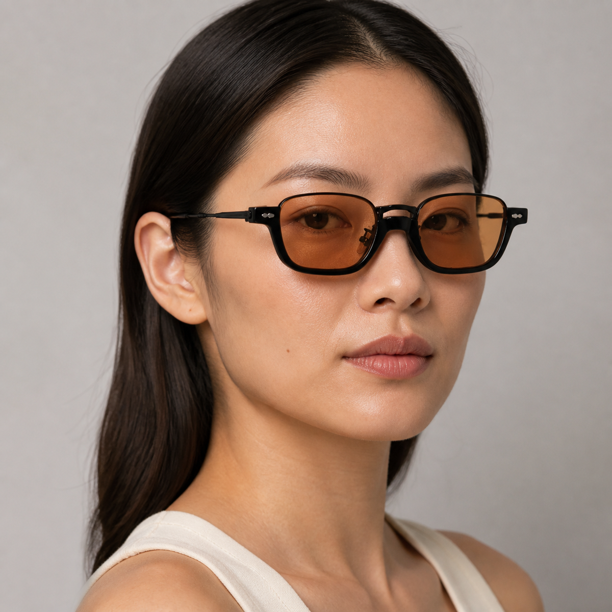 Women’s Black sunglasses worn by an adult East Asian woman