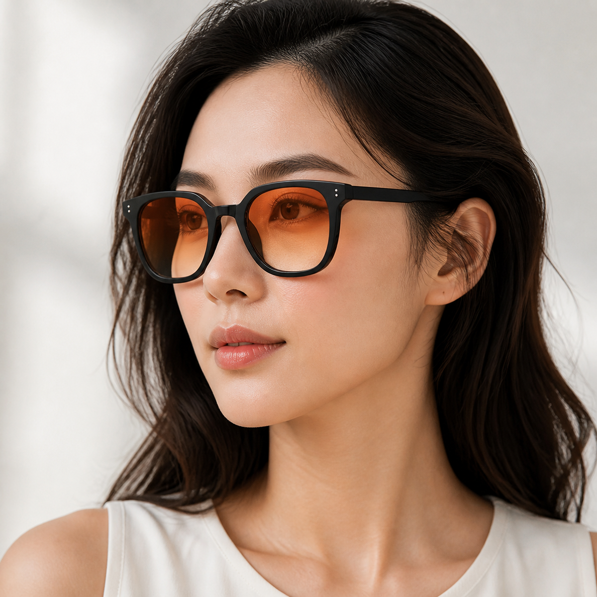 Women’s Black sunglasses worn by an adult East Asian woman