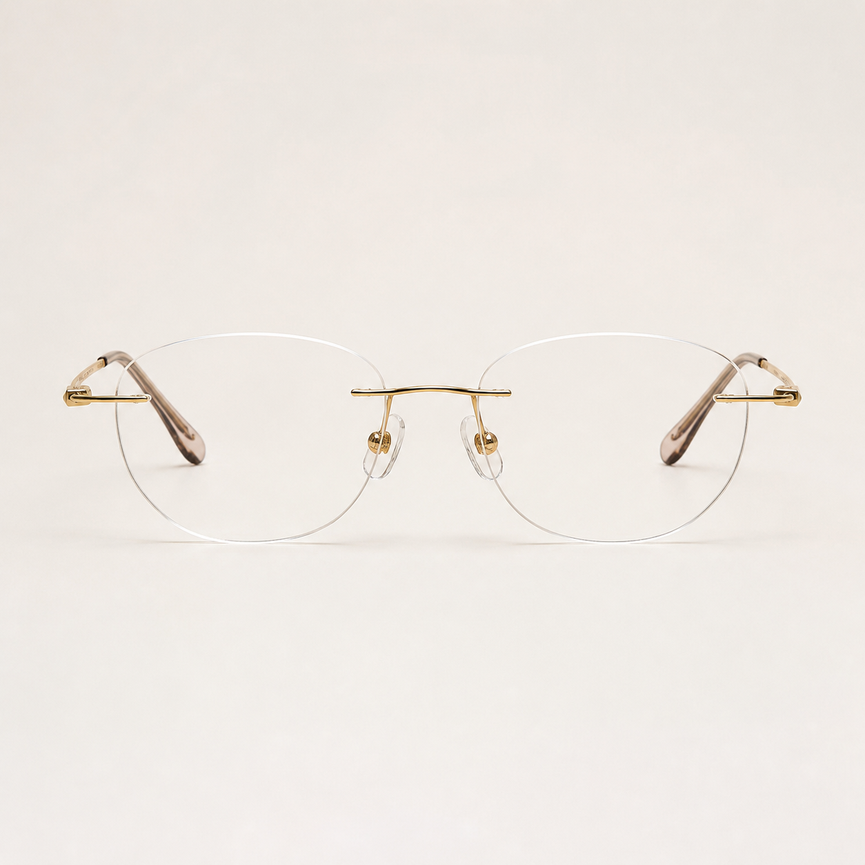 Gold titanium rimless round eyeglasses, straight-on product view