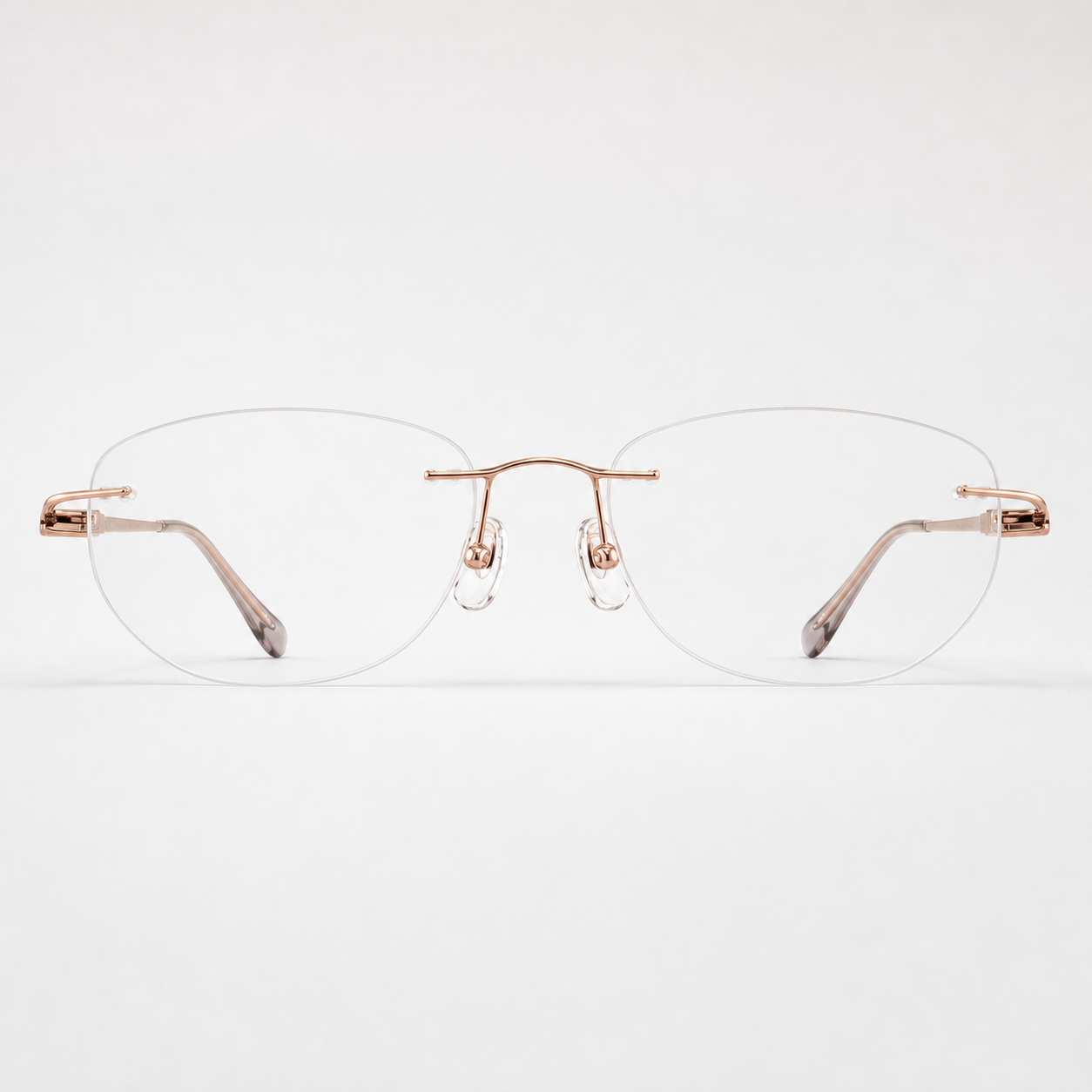Rose Gold titanium rimless round eyeglasses, straight-on product view