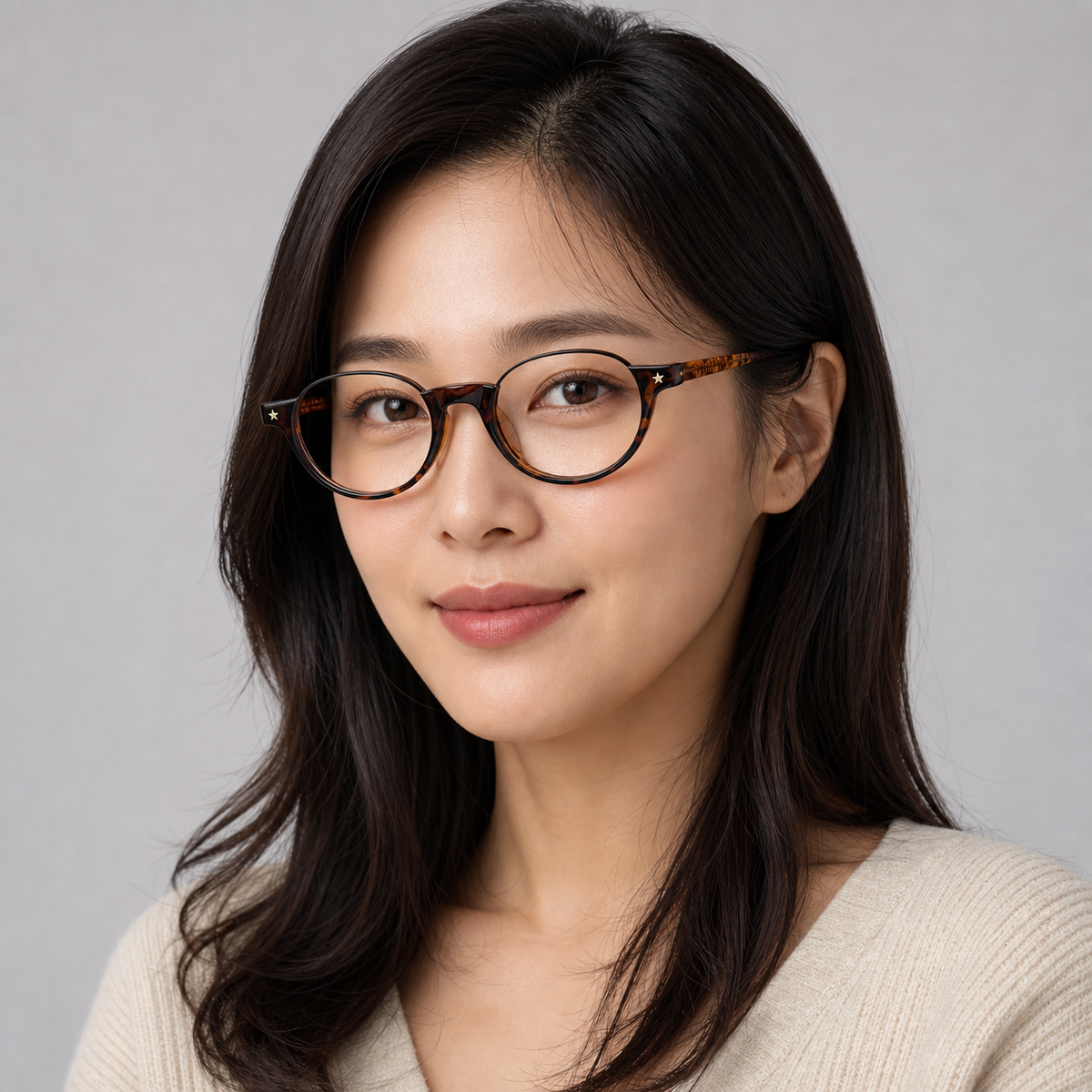 Tortoise TR and metal semi-rimless glasses worn by an adult East Asian woman