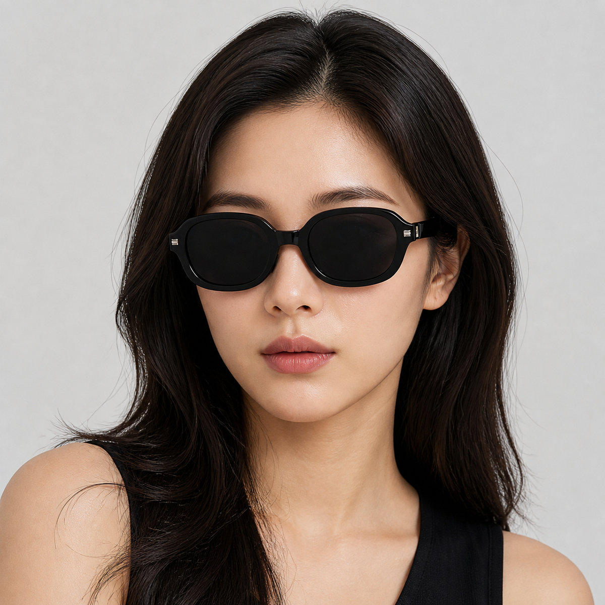 Black soft-square sunglasses on an adult woman, front model view