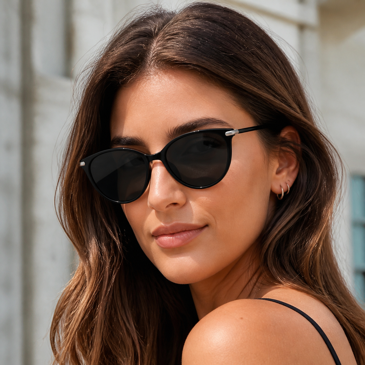 Women’s Black full-rim oval cat-eye sunglasses, front adult model fit